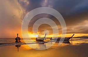 Traditional thai boats at sunset beach. Ao Nang Krabi province