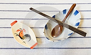 Traditional Thai Chicken Bowl with Chopsticks and Wooden Spoon