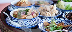 Traditional Thai food on bamboo tray or Khan Toke, local food in Northern of Thailand