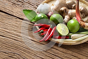 Traditional Thai food cuisine on Herb ingredient of Tom Yum spicy soup wood background