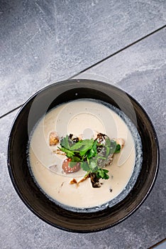 Traditional Thai food Tom Kha Gai in bowl Copy space