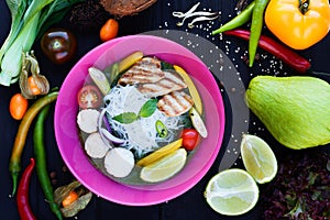 Traditional thai green curry with grilled chicken, lime, funchoz