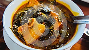 Traditional Thai herb recipe,Curry pork with Chamuang (Garcinia cowa) leaves, Local Thai food call as Gang moo cha muang