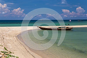 Traditional thai long boat at a beach