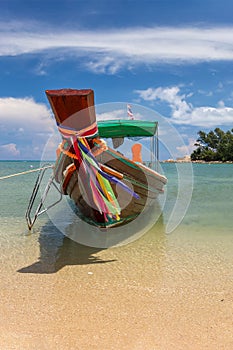 Traditional thai longtail boat at a beach