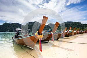 Traditional thai longtail boat at Ton Sai Beach on Phi Phi Don island, Thailand in a summer day