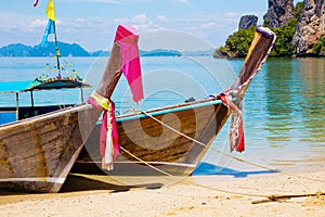 Traditional Thai Longtail Boats Moored At Aonang Beach photo