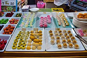 Traditional Thai pretty little desserts shaped into mini Thai fruits, vegetables like mangos, chilis and mangosteens. Thai name is