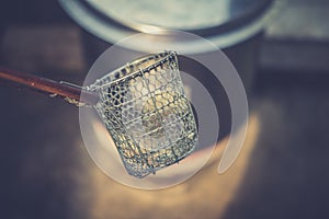 Traditional Thai steel wire mesh noodle strainer