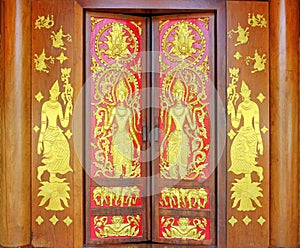 Traditional thai style carve on the wood door, temple of thailand