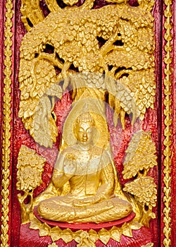 Traditional Thai style carving and painting art at the temple