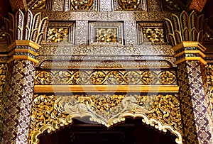 Traditional Thai style wood carving door in thailand temple