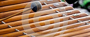 Traditional Thai Wooden Xylophone with Mallet. Close-up of a wooden xylophone, known as \'Ranat\' in Thailand.