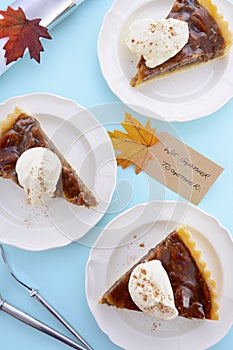 Traditional Thanksgiving Pecan Pie on Pale Blue Wood.