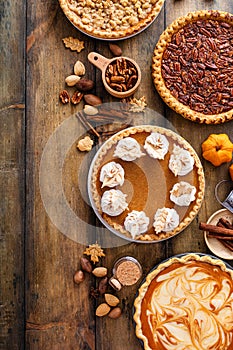 Traditional Thanksgiving pies with pumpkin pie in the middle