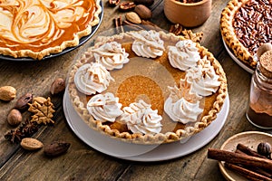 Traditional Thanksgiving pumpkin pie topped with whipped cream