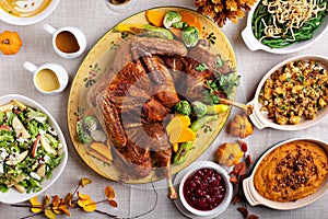 Traditional Thanksgiving table with turkey and sides