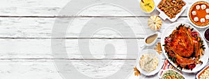 Traditional Thanksgiving turkey dinner side border on a rustic white wood banner background