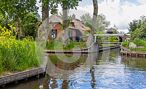 Traditional thatched roof home in famous Giethoorn village in the Netherlands. Car free village