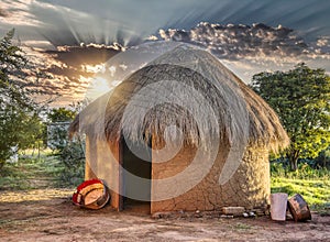 traditional thatched roof hut in a village