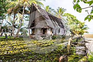 Traditional thatched yapese men`s meeting house faluw or fale. Yap island, Micronesia, Oceania. photo