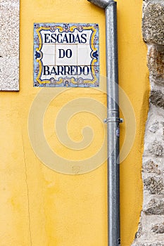 Traditional tile sign for the stairs to the Barredo district