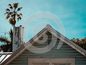 Traditional timber roof of an old house, with its rustic roof tiles and cobblestone chimney stacks