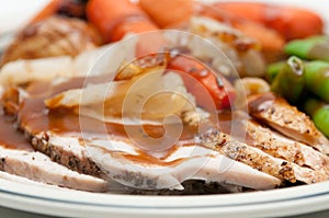 traditional turkey dinner with crispy skin, turkey slices and fr