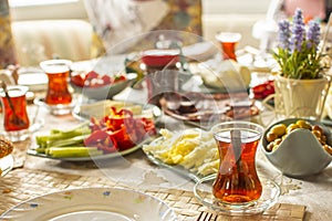 Delicious rich Traditional Turkish breakfast and tea cups. Ramadan Suhoor aka Sahur. photo