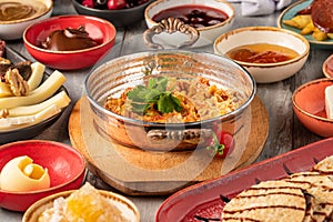 Traditional Turkish Breakfast served with traditional turkish tea on stone table