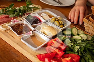 Traditional turkish breakfast on a wooden plate