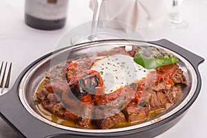 Traditional Turkish Bursa Iskender Kebap Garnished with Grilled