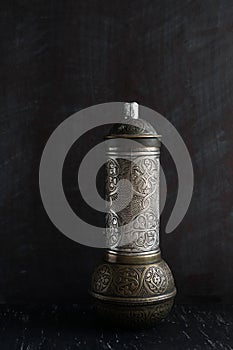 Traditional Turkish coffee and concept. vintage coffee grinder on a dark background