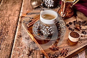 Traditional turkish coffee cup and roasted coffee beans