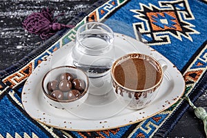 Traditional Turkish coffee in porcelain cup on wooden table. Anatolian Traditional Drink Hot and Delicious Turkish Coffee