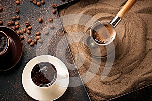 Traditional turkish coffee prepared on hot sand