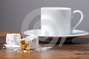Traditional Turkish coffee served in classical cups with Turkish delights