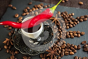 Traditional turkish coffee in vintage cup, anise, roasted beans with hot spicy chili pepper on brown background 4