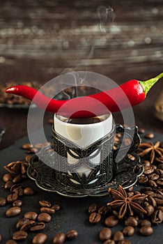 Traditional turkish coffee in vintage cup, anise, roasted beans with hot spicy chili pepper on brown background 5