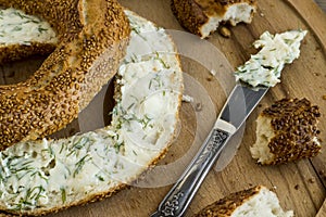 Traditional Turkish,crispy bagel,simit with creamy cheese on wooden plate