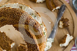 Traditional Turkish,crispy bagel,simit with creamy cheese on wooden plate