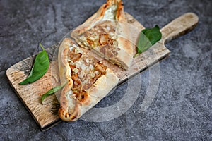 Traditional Turkish cuisine. Baked Pide dish with chicken . Turkish pizza pide