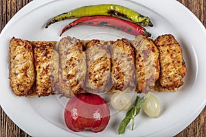 Traditional Turkish Cuisine, Grilled chicken wings baking on wooden background, top view