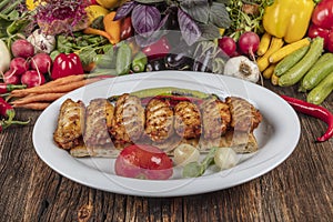 Traditional Turkish Cuisine, Grilled chicken wings baking on wooden background, top view