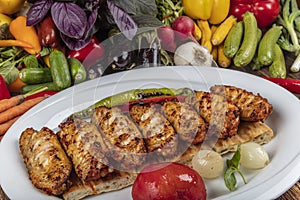 Traditional Turkish Cuisine, Grilled chicken wings baking on wooden background, top view