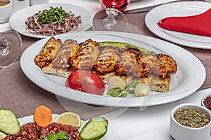 Traditional Turkish Cuisine, Grilled chicken wings baking on wooden background, top view