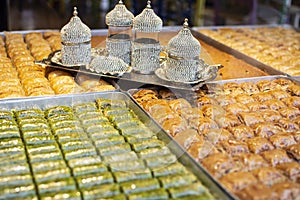 Traditional Turkish dessert Baklava near with Turkish coffee on the stall. Sweets for iftar.
