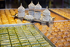 Traditional Turkish dessert Baklava near with Turkish coffee on the stall. Sweets for iftar.