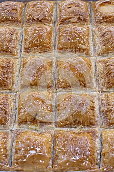 Traditional Turkish dessert Baklava on the stall. Sweets for iftar.