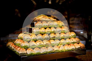 Traditional Turkish dessert Baklava on the stall. Sweets for iftar. Famous Turkish delight. Middle eastern deserts.